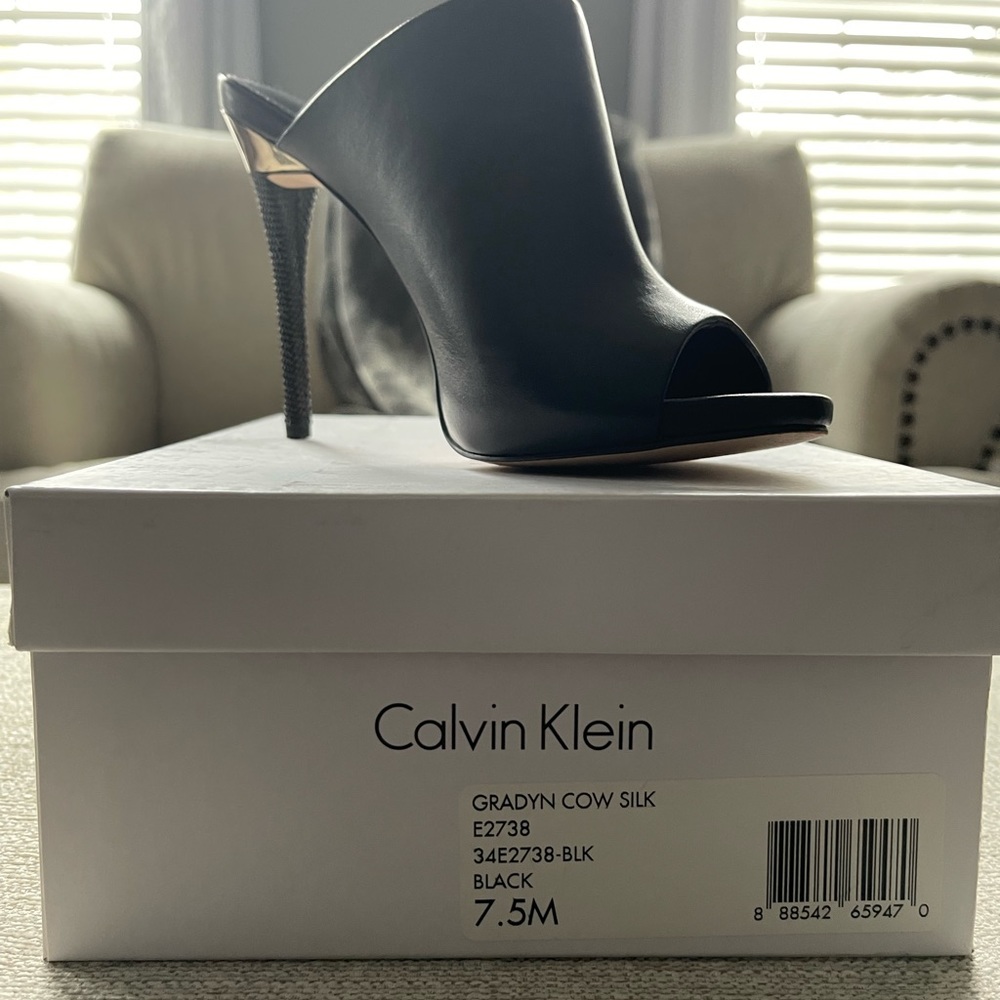 Calvin Klein Black leather stiletto slides.